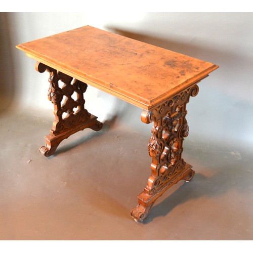 385 - A Victorian Burr Walnut Centre Table, the rectangular moulded top above twin end carved and pierced ... 