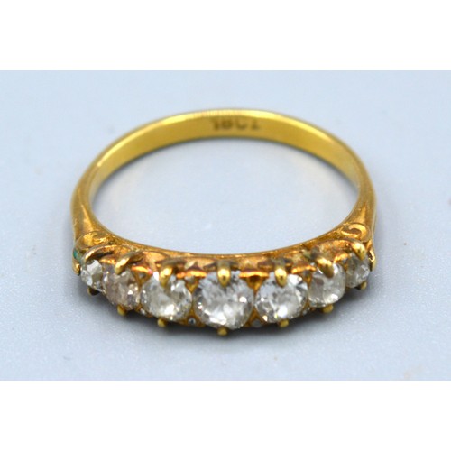 148 - An 18ct. Gold Seven Stone Diamond Ring, the seven graduated stones claw set, 2.9 gms. ring size O