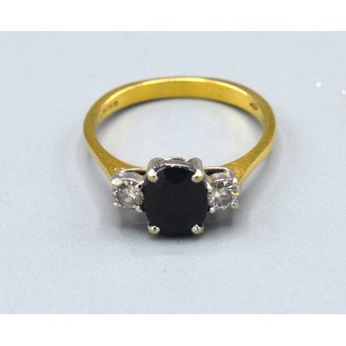 113 - An 18ct. Yellow Gold Sapphire And Diamond Set Ring with central oval sapphire flanked by two diamond... 