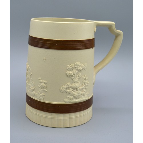 32 - A Staffordshire Brown Glazed Stoneware Tankard by John Turner decorated in relief with classical fig... 