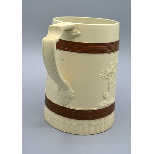 32 - A Staffordshire Brown Glazed Stoneware Tankard by John Turner decorated in relief with classical fig... 