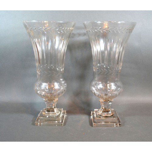 36 - A Pair Of Cut Glass Flared Rim Storm Vases with square stepped bases 40 cms tall