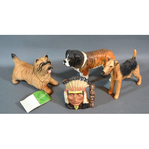 40 - A Beswick Model Of A St. Bernard together with two other Beswick model dogs and a North American Ind... 