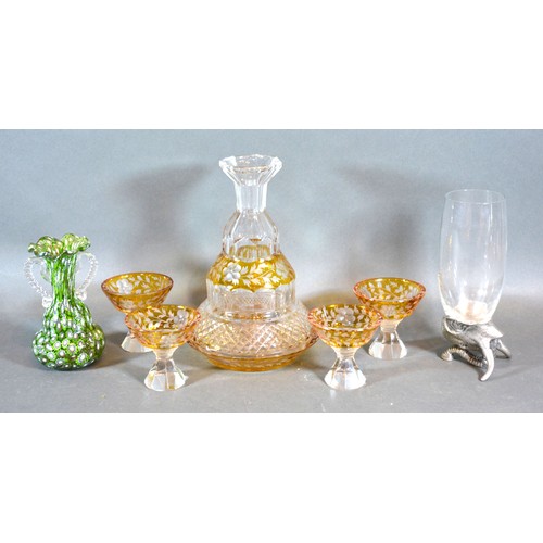 42 - A Cut Glass Decanter with four matching small glasses all engraved decorated upon a yellow ground to... 