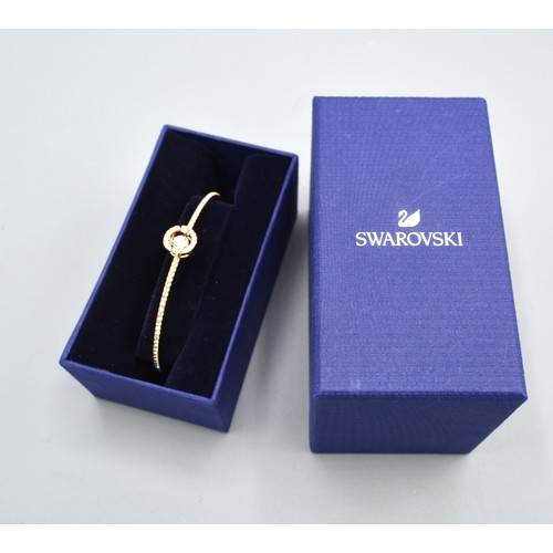 186 - A Swarovski Sparkling Dance Bangle, gold plated with original box