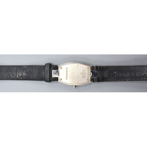 187 - Tiffany & Co. 18ct. White Gold Tonneau Diamond Set Ladies Wrist Watch, a black leather strap set wit... 