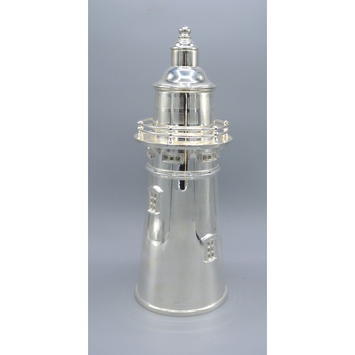 201 - A Silver Plated Cocktail Shaker in the form of a lighthouse 34 cms tall