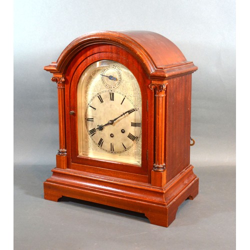 320 - A  Mahogany Mantle Clock By Gustav Becker, the dome top case with arched glazed door flanked by colu... 