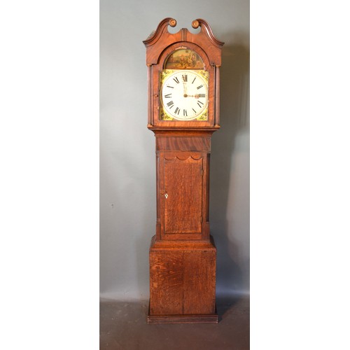 322 - A 19th Century Mahogany And Oak Long Case Clock, the arched hood with broken swan neck pediment abov... 