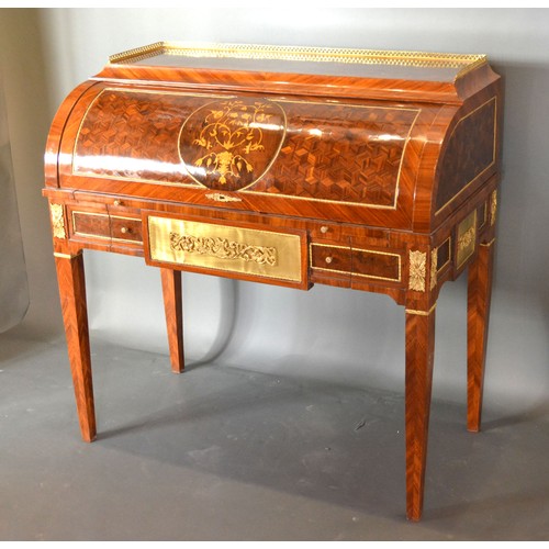 442 - A French style marquetry inlaid and gilt metal mounted bureau, the low brass gallery above a cube an... 