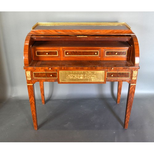 442 - A French style marquetry inlaid and gilt metal mounted bureau, the low brass gallery above a cube an... 