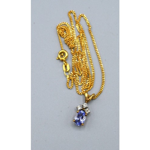 109 - A 9ct. Gold Pendant set oval tanzanite with three diamonds above together with a 9ct. gold chain 3 g... 