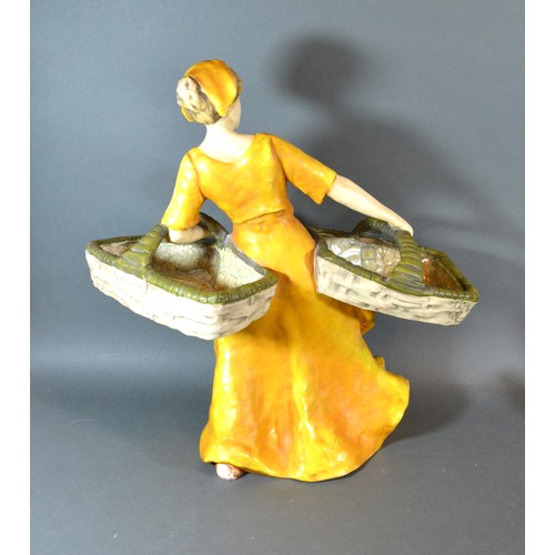 295 - A Continental Figure Of A Lady Holding Two Baskets Wearing Yellow Dress 42 cms tall