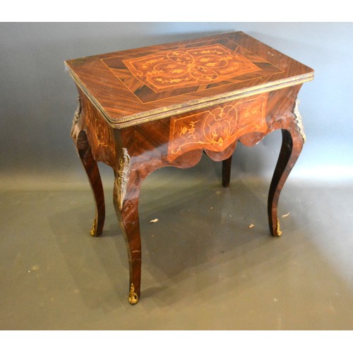 678 - A French inlaid and gilt metal mounted card table, the hinged top above a shaped inlaid frieze, rais... 