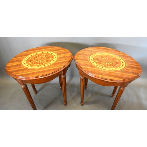 682 - A Pair of French marquetry inlaid oval lamp tables each with an oval marquetry inlaid moulded top ab... 