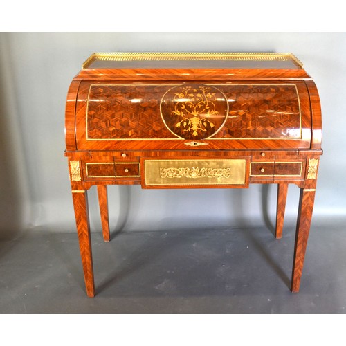 684 - A French style marquetry inlaid and gilt metal mounted bureau, the low brass gallery above a cube an... 