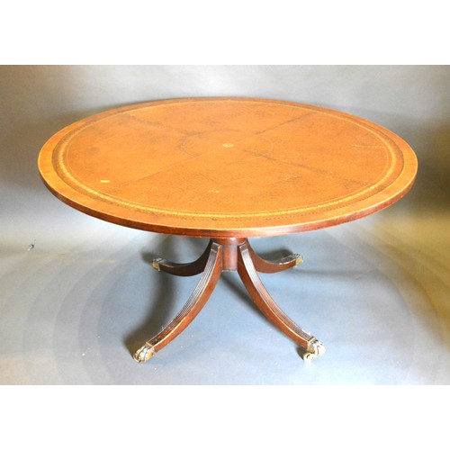 662 - A 20th Century Mahogany Octagonal Centre Table, the cross banded top above a square column 180 cms d... 