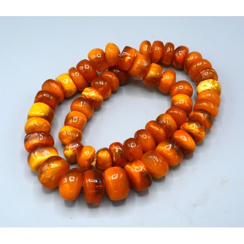 104 - An Amber Coloured Bead Necklace