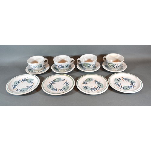 32 - Marianne De Trey, A Studio Pottery Breakfast Set comprising four cups and saucers and four side plat... 