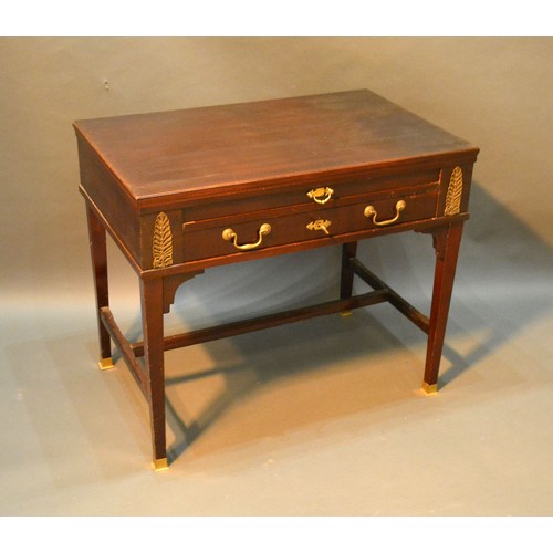 361 - A French Writing Desk with a pullout writing surface above a drawer with brass handles raised upon s... 