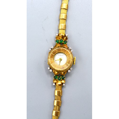 121 - A Gubelin Ladies' 18ct. Gold Cased Wrist Watch set with diamonds and emeralds and with 18ct. gold st... 