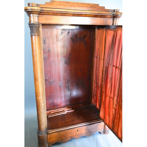 302 - A 19th Century Beidermeier Cabinet, the moulded top above a fabric pleated and bow glazed door flank... 