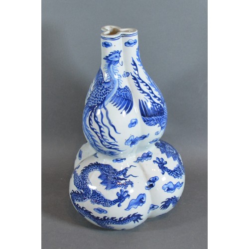 22 - A 19th Century Chines porcelain Gourd vase of triform decorated in undeglaze blue with serpents, blu... 