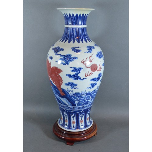 21 - A Chinese porcelain oviform vase decorated with iron red and under glaze blue and six character mark... 