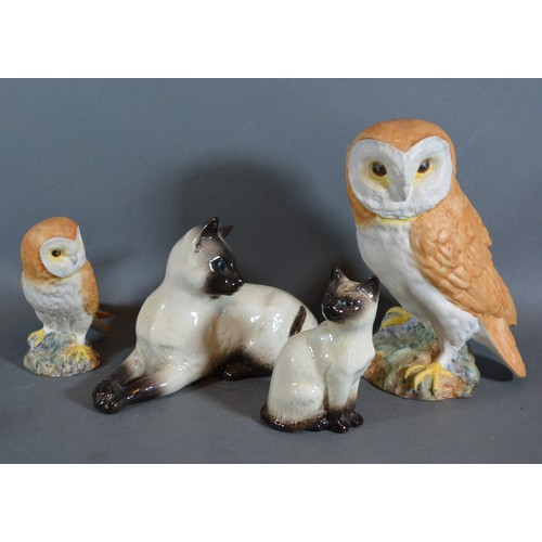 19 - A Beswick model in the form of an owl together with another similar smaller and two Beswick models o... 