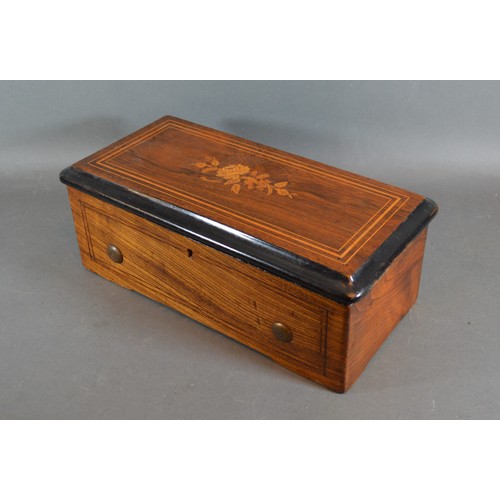 245 - A 19th Century Swiss music box, within an inlaid case, 34cms long