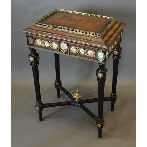 322 - A 19th Century French burr walnut, ebonised, gilt metal and porcelain mounted jardiniere, with turne... 