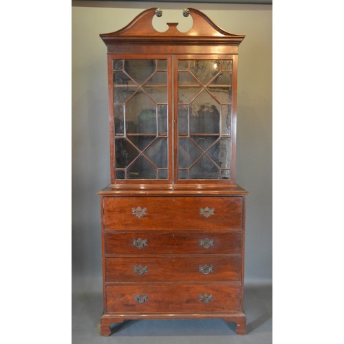 321 - A Regency mahogany secretaire bookcase, the moulded cornice above two astragal glazed doors enclosin... 