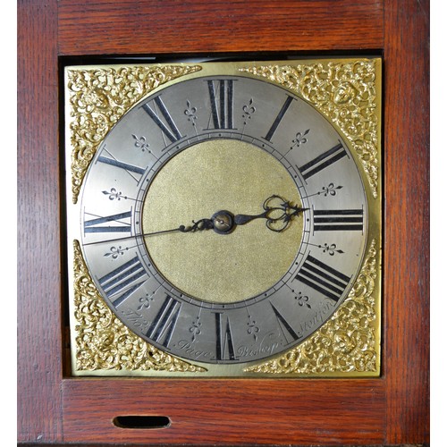 273 - A 19th Century oak long case clock the rectangular hood with brass finials above a rectangular door,... 