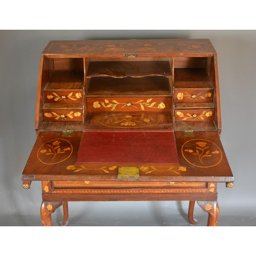 315 - A 19th Century Dutch Marquetry bureau, the fall front enclosing a fitted inlaid interior above two d... 