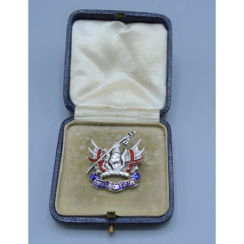 94 - A 9ct gold Military brooch set with red and blue enamel, 6.8 grams