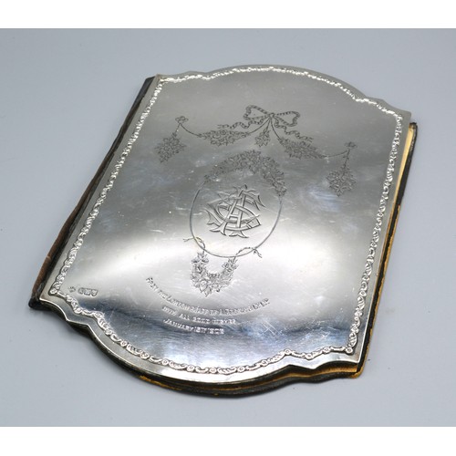 180 - An Edwardian Silver Mounted Blotter with engraved and embossed decoration, London 1905, 30cms x 20cm... 