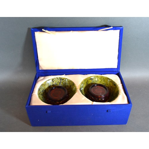 251 - A Pair Of Chinese Jade Bowls upon hardwood stands 13.5cms diameter within fitted lined box