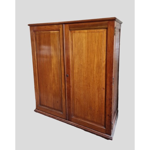 326 - A Late Victorian Mahogany Dwarf Wardrobe, the moulded top above two panel doors enclosing sliding tr... 