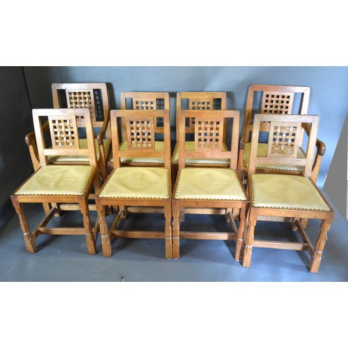 328 - Robert (Mouseman) Thompson, A Set Of Eight (two arms and six singles) Oak Dining Chairs each with a ... 