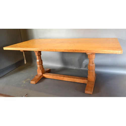 329 - Robert (Mouseman) Thompson, An Oak Refectory Dining Table, the adze carved top above twin end octago... 