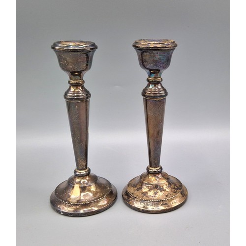 95 - A pair of Birmingham silver candlesticks, 15cms tall