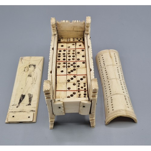 252 - A Napoleonic prisoner of war model in the form of a cradle, the scrimshaw inner cover enclosing a se... 