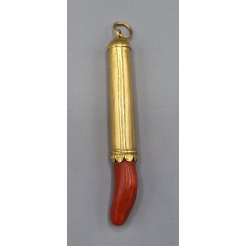 96 - A 19th century yellow metal and coral teether of tapering form, with engraved collar and suspension ... 