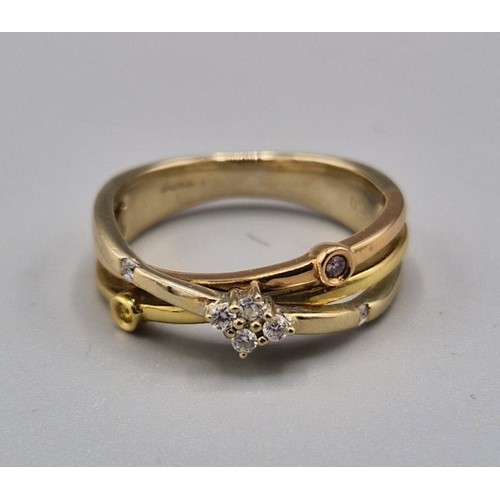 104 - An 18ct gold crossover ring set with four diamonds, 5.1 grams, ring size M