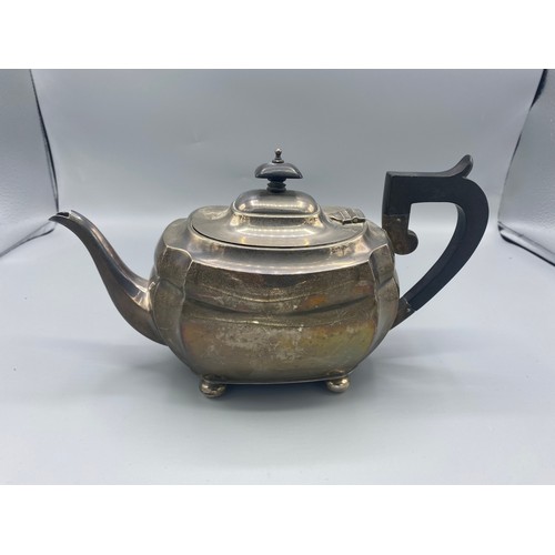 123 - A Birmingham silver teapot of shaped form, with ebonised handle, 16ozs all in