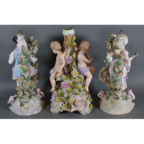 53 - A pair of German porcelain figures decorated in polychrome enamels and highlighted with gilt, 26cms ... 