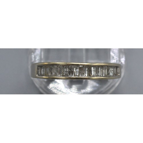 220 - A 14ct. White Gold Half Eternity Ring set with baguette diamonds, 5gms. ring size N