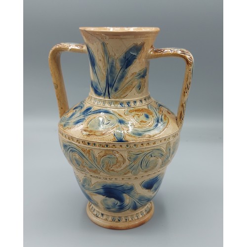 4 - A Doulton Lambeth stoneware two handled vase by Arthur Barlow, with incised scrolls upon a blue and ... 