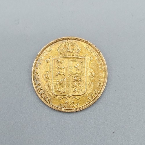 146 - A Victorian gold shield back half Sovereign dated 1887