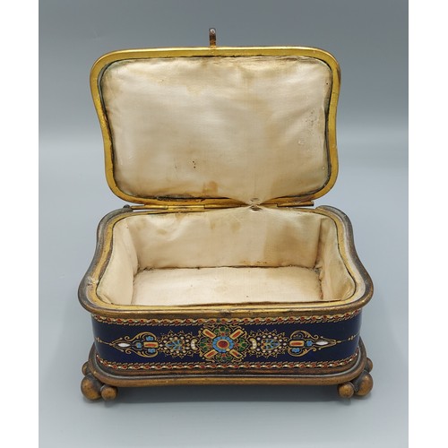 7 - A late 19th Century French porcelain and enamel casket, the hinged cover enclosing a padded interior... 